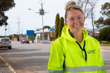 A member of Adelaide Plains Council's horticulture team, smiling, as they work in Dublin South Australia.