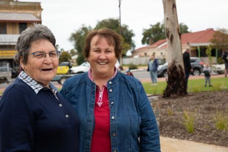 2 smiling residents at the opening of the Two Wells Village Green.