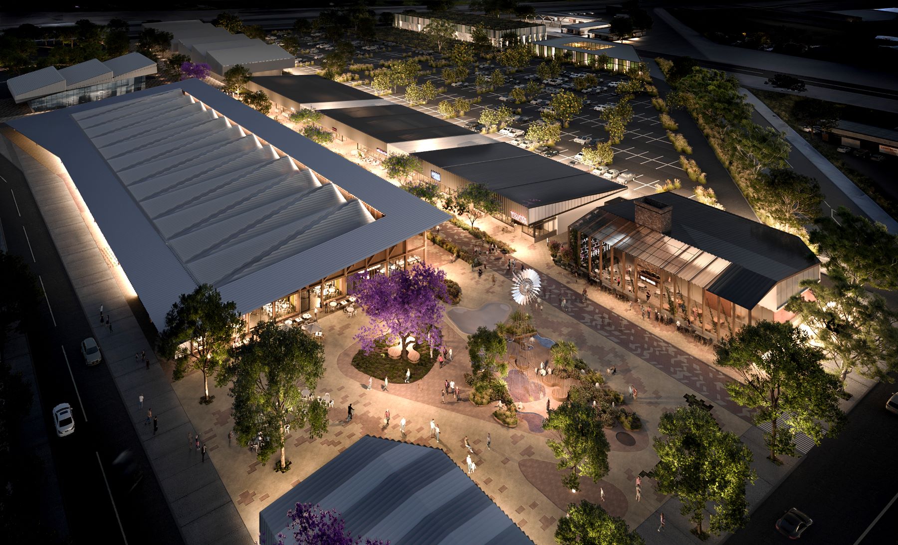 Artist impression of the future Two Wells Town centre viewed from above at night. Landscaped open spaces sit amongst rectangular, country-style buildings accessed by wide footpaths at the front.